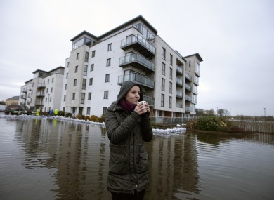 Emily Topka sips on a mug of tea outside the Bastion Apartments in Athlone, from which residents were evacuated during January.