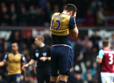 Arsenal striker Olivier Giroud holds his head in his hands