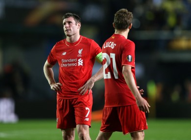 Liverpool's James Milner (left) shows his dejection after the final whistle.