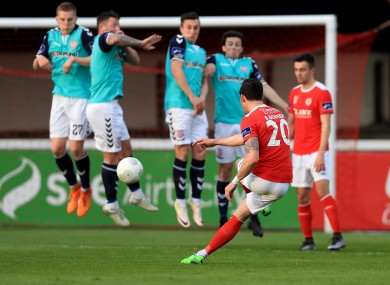 Saints winger Billy Dennehy takes a free-kick during Friday's loss to Derry.