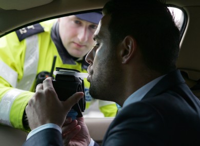 Garda David Maguire and posed model Mark Adams being tested for drink driving in 2011.