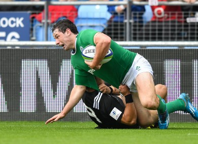 James Bollard of Ireland is tackled.