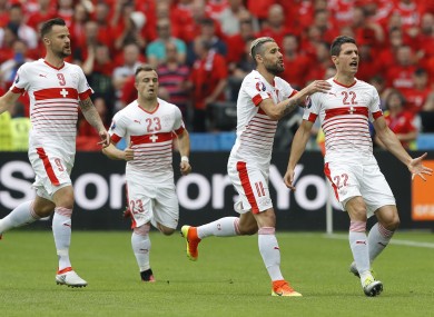 Switzerland's Fabian Schaer, right, celebrates with teammates.