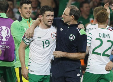 Ireland coach Martin O'Neill hugs Robbie Brady as they celebrate at the end of the Euro 2016 Group E soccer match.