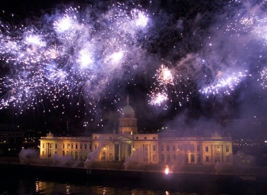 Dublin's Custom House lit up by fireworks during the St. Patrick's Day Festival in the year 2000.