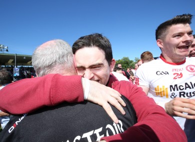 Mickey Harte celebrates Tyrone' s 14th Ulster title with his son at Clones.