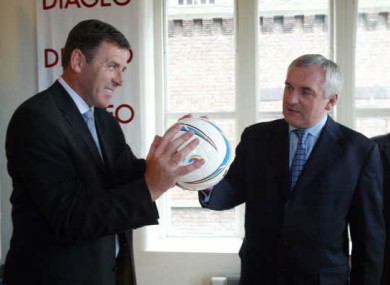 Bertie Ahern with former soccer player Packie Bonner, holding a (foot)ball