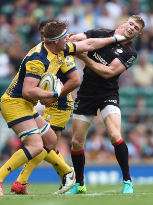 Van Velze hands off Chris Ashton in the meeting with Saracens.