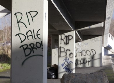 Memorials in the form of flowers, candles, flags, posters, banners and graffiti both on and under the pedestrian footbridge across the Tallaght Dual Carriageway, on which Dale Creighton was seriously assaulted