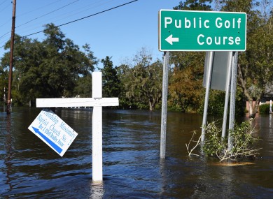 Floodwater surround road signs ub Nichols, North Carolina, as people were rescued from Hurricane-related flooding.
