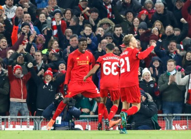 Liverpool's Divock Origi celebrates scoring his side's first goal of the game with teammates during the EFL Cup last night.