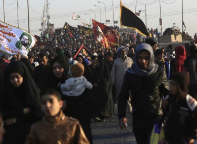 Shiite pilgrims make their way to Karbala for Arbaeen on Wednesday.