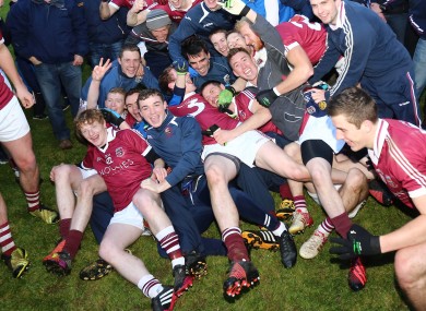 Slaughtneil's players celebrate their Derry final win against Loup last month.