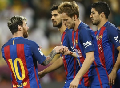 The Barca players celebrate a goal.