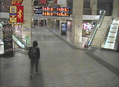 Anis Amri, the main suspect in Berlin's deadly Christmas market attack walks through an Italian train station on 22 Dec