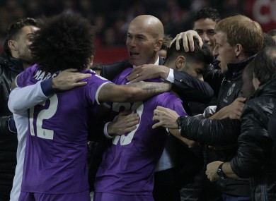 Real Madrid's coach Zidane, celebrates with Real Madrid's players after Marco Asensio scored during a Spain's King's Cup soccer match.