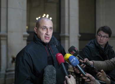 Vjeran Tomic faces the media at court for his trial in Paris.