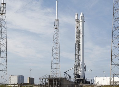 A Falcon 9 rocket carrying the SpaceX Dragon spacecraft sits at launch complex 40 at the Cape Canaveral Air Force Station in Cape Canaveral, Florida.