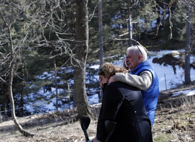 Family members look on at the Germanwings plane crash site.