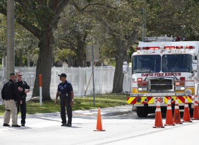 Authorities stand outside the entrance to the David Posnack Jewish Community Center and David Posnack Jewish Day School after people were evacuated because of a bomb threat, Monday, February 27, 2017, in Davie, Florida.