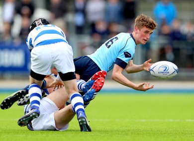 Blackrock' Sam Small and Adam Dixon tackle Oscar Hurley of Michael's.