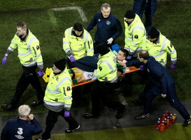 Ireland captain Seamus Coleman is comforted by manager Martin O'Neill while being stretchered off during Friday night's draw with Wales.