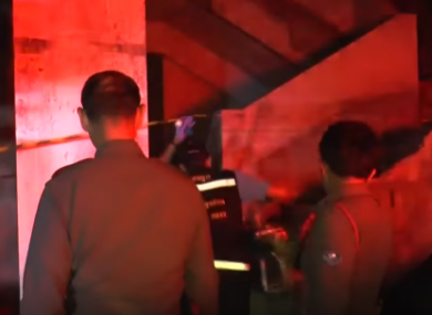 Police arrive at an abandoned building in Thailand.