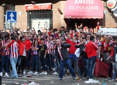 Police clash with Atletico Madrid fans outside the ground before the game.