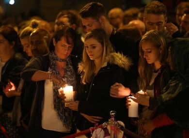 Mourners light candles and pause for a minute's silence in St Ann's Square, Manchester, as they mark the passing of exactly a week since the Manchester Arena terror attack.