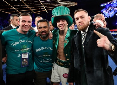 Michael Conlan celebrates with Matthew Macklin, Manny Robles and Conor McGregor after winning his professional debut on St Patrick's Day.