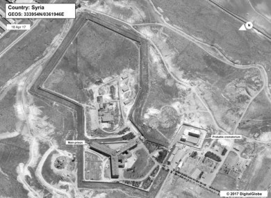 This image provided by the State Department and DigitalGlobe, taken April 18, 2017, a satellite image of what the State Department described as a building in a prison complex in Syria that was modified to support a crematorium.