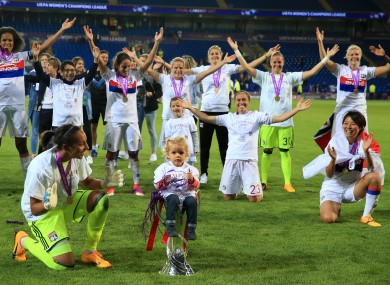 Lyon celebrate their Champions League win.