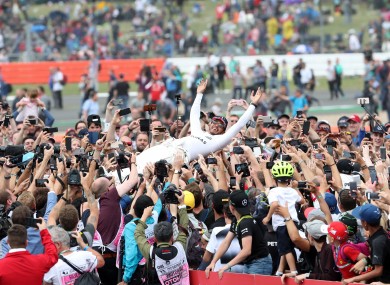 Hamilton celebrates his victory at Silverstone.