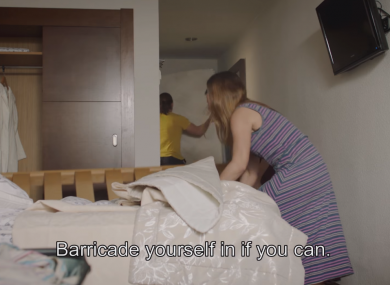 A screengrab from the video showing a family barricading themselves into their hotel room.