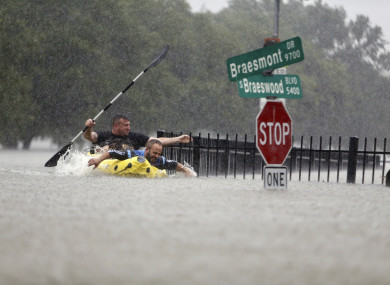 Two kayakers trying to beat the current in Houston