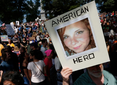 A demonstrator holds a photo of Heather Heyer, who was killed in Charlottesville, at a rally in Boston last weekend