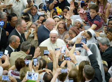 Pope Francis is cheered by faithful during his weekly general audience at the Vatican earlier this month.