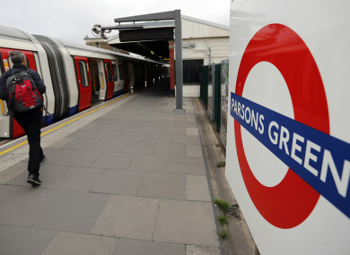 Travellers board the tube at the Parsons Green station.