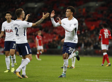Tottenham's Dele Alli, right, celebrates with Tottenham's Kieran Trippier after he scores a goal.