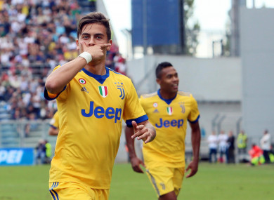 Paulo Dybala celebrates after scoring during a Serie A soccer match between Sassuolo and Juventus.