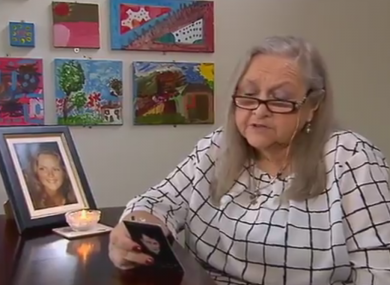 Josephine Pender reciting a prayer on the 21s anniversary of her daughter's disappearance