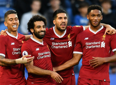 The Liverpool players celebrate Mohamed Salah's goal.