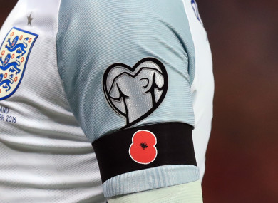 File photo of a detailed view of Wayne Rooney's black armband with a poppy on.