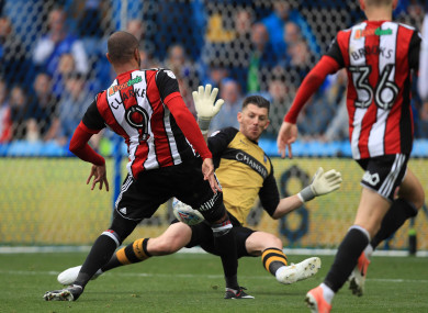 Leon Clarke scores past Keiren Westwood.
