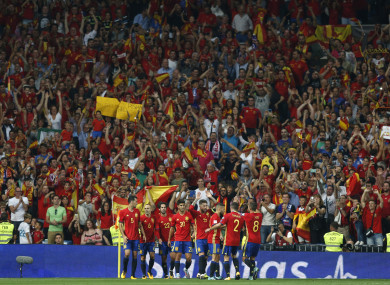 Spain's Isco, centre, celebrates with team mates after scoring his side's second goal.