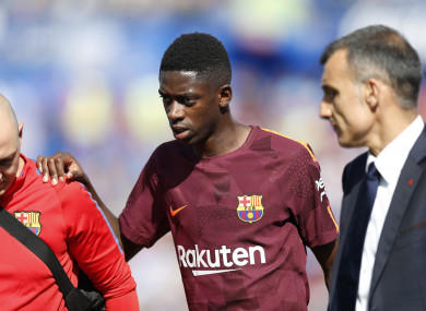 Dembele limped off during Barcelona's 2-1 win against Getafe.