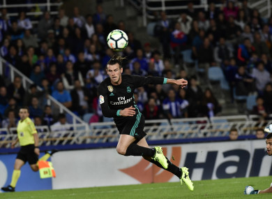 Real Madrid's Gareth Bale scores past Real Sociedad's goalkeeper Tono Ramirez.