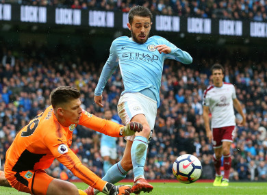 Bernardo Silva pushes the ball past Nick Pope.