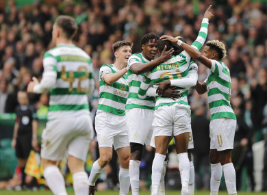 The Celtic players congratulate match-winner Olivier Ntcham.