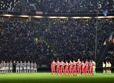 Players observe a minute of silence prior to the Serie A soccer match between Juventus and Spal at the Allianz Stadium in Turin.